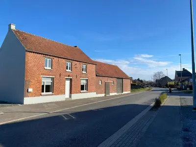 a brick building on the side of a street at De oude es in Bocholt
