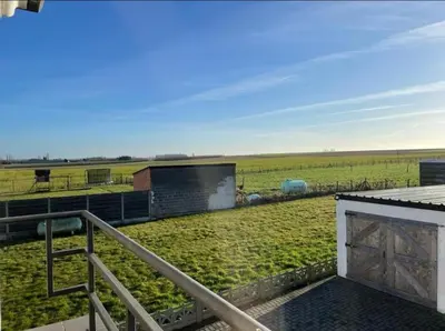 a view of a field from the roof of a house at Het Damhert in Kortenaken