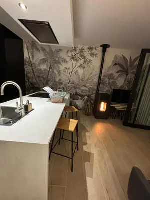 a kitchen with a sink and a counter top at Le Makalle in Dalhem