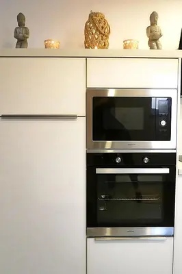 a microwave oven sitting on top of a cabinet at SuiteDreams - Relax Suite Liège in Liège