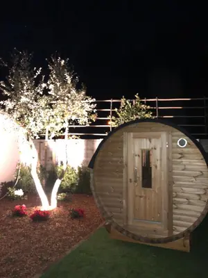 a small wooden hobbit house in a garden at night at de Kegelhoeve in Zonhoven