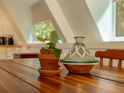 two vases sitting on top of a wooden table at Boshuisje Rekem - Boris in Lanaken