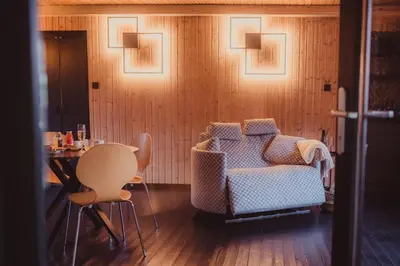 a living room with a couch and a table at Ô NaNo Glamping in Dalhem