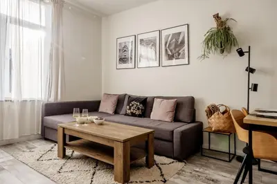 a living room with a couch and a coffee table at Marshmallow in Liège
