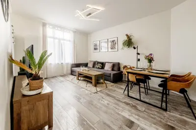 a living room with a couch and a table at Marshmallow in Liège