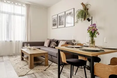 a living room with a couch and a table at Marshmallow in Liège