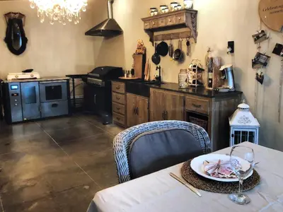 a kitchen with a table with a plate of food on it at Welness gastenverblijf Carpe Diem in Oudsbergen