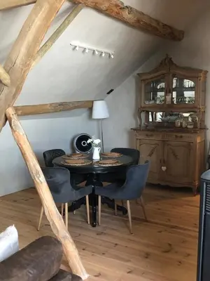 a dining room with a table and chairs at Welness gastenverblijf Carpe Diem in Oudsbergen