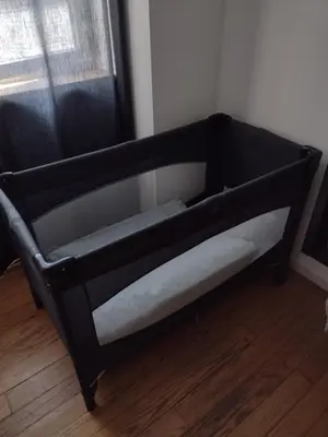 a black bunk bed in a room with a window at bij Petros in Oudsbergen