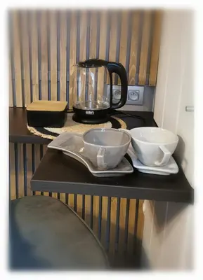 a counter with two bowls and a blender on it at Bed & Bokes aan de Maaskant in Lanaken