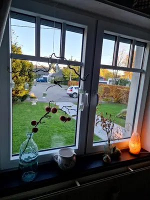 a window with a view of a parking lot at Haus Dany in Raeren
