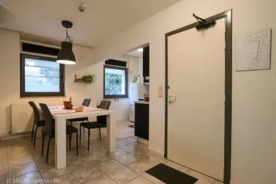 a kitchen and dining room with a table and chairs at De Millenniumhoeve (Willy) in Riemst