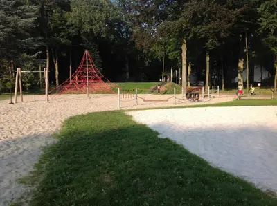 a playground in a park with a red structure at Hengelhoef Acacia 3 in Drijhoeven