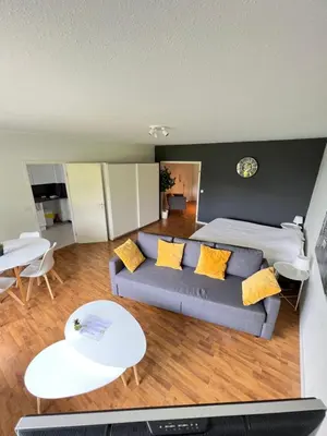 a living room with a couch and a bed at Alexis's loft in Liège