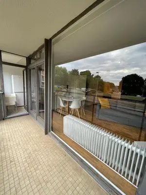 a room with a balcony with a view of a table at Alexis's loft in Liège