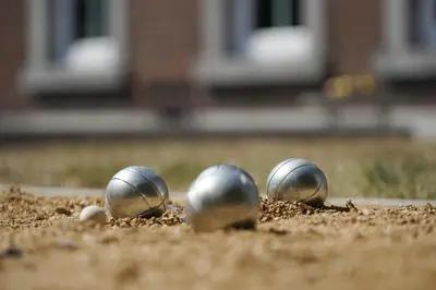 three metal spheres sitting in the dirt at Gîtes Chez Oncle Nicolas in Soumagne