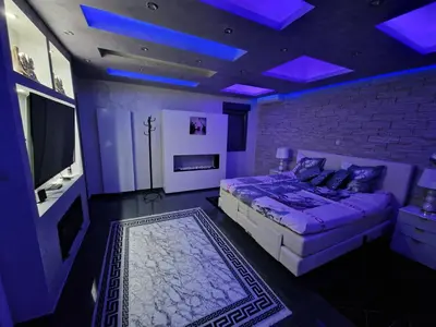 a bedroom with a bed and a brick wall at Tendresse - Espace Détente Ensival in Verviers