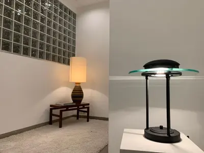 a lamp sitting on a table next to a table with a stool at Le Loft Nautilus by Maison Brasseurs d'Etoiles in Liège