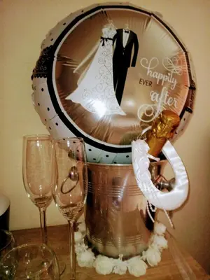 a mirror with a wedding dress in it with two glasses at JustB in Riemst