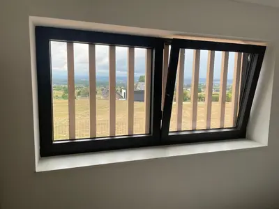 a window with a view of a field at Tiny house moderne in Thimister