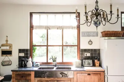 a kitchen with a sink and a window at Villa Vigor in Peer