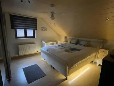 a bedroom with a large bed in a room at Huys In As in As