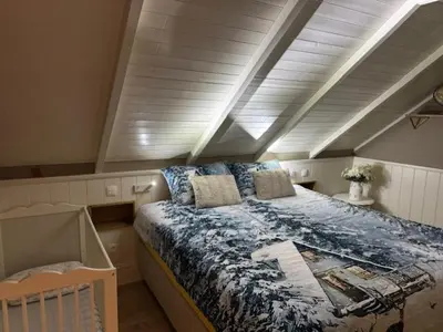 a bedroom with a large bed in an attic at Huys In As in As
