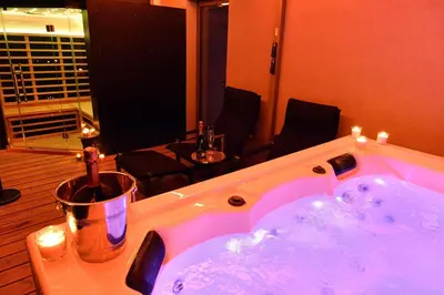 a bathroom with a jacuzzi tub in a room at SuiteDreams - Sky Suite - Liège in Liège
