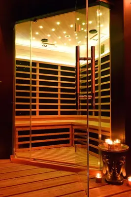 a room with a large window with a table and candles at SuiteDreams - Sky Suite - Liège in Liège