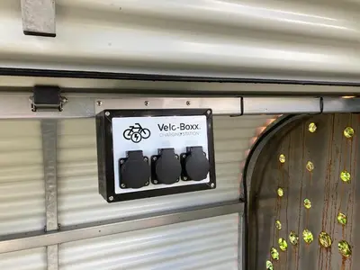 a sign that says v bike box on a wall at Shelter in Zutendaal