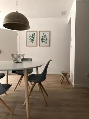 a dining room with a table and chairs at Recreatiedomein Warredal - The Lodge in Neeroeteren