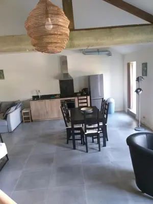 a kitchen and dining room with a table and chairs at De Hoog Velden 14 in Pelt