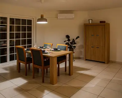 a dining room with a wooden table and chairs at Kanaalzicht21 in Hasselt