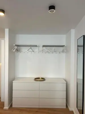 a white bathroom with a sink and a mirror at Triplex d'architecte en hypercentre in Liège