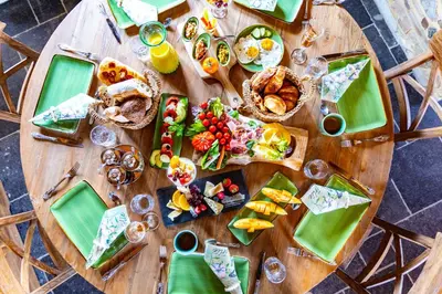 a wooden table with food on top of it at La belle Maison in Sippenaeken