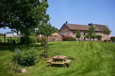 a picnic table in the yard of a house at La belle Maison in Sippenaeken