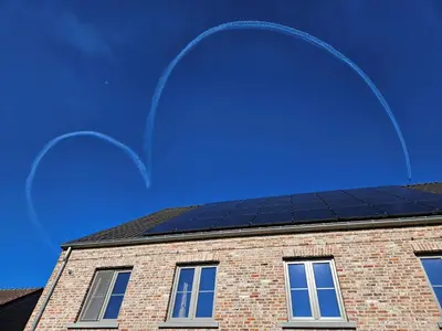a building with a solar panel on top of it at B&B Pippa in Peer