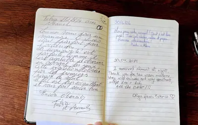 an open notebook with handwriting on the pages at Studio confort Verviers in Verviers