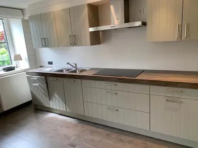 a kitchen with a sink and a counter top at Country house Clos des hortensias in Blégny