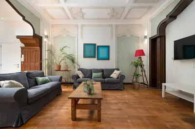 a living room with two couches and a coffee table at Amazing appartement à Liège avec jardin in Liège
