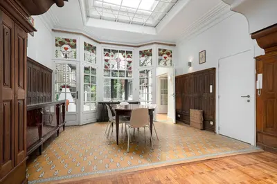 a large dining room with a table and chairs at Amazing appartement à Liège avec jardin in Liège