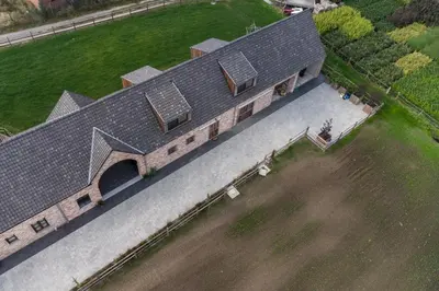 an overhead view of a house with solar panels on it at Logies Op 't Gestel in Oudsbergen