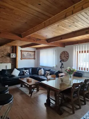 a living room with a couch and a table at mignon in Soumagne