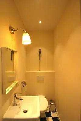 a bathroom with a white sink and a toilet at Duplex de 3 chambres en plein centre ville - 82/3A in Liège