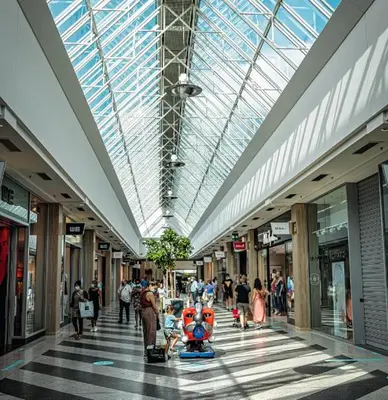 a large shopping mall with people walking in it at Appartement 021 in Liège