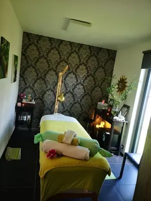 a bedroom with a bed with towels on it at Nimary Logies in Heusden - Zolder