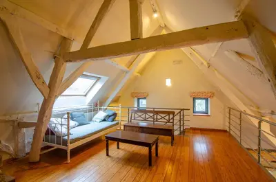 a living room with a couch and a table at Vakantiewoning De Luysmolen in Bocholt