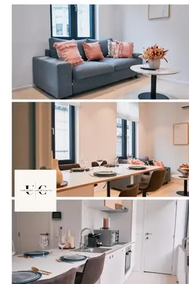 a living room with a couch and a table at Urbanchic Appart lumineux hyper centre in Liège