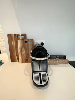 a trash can sitting on top of a table at Urbanchic Appart lumineux hyper centre in Liège