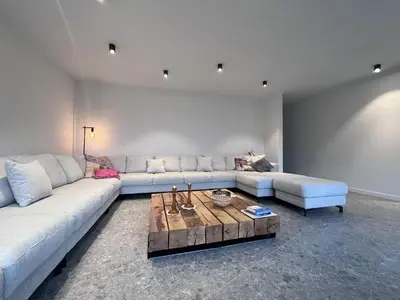 a living room with a couch and a coffee table at Bigaro II in Heers